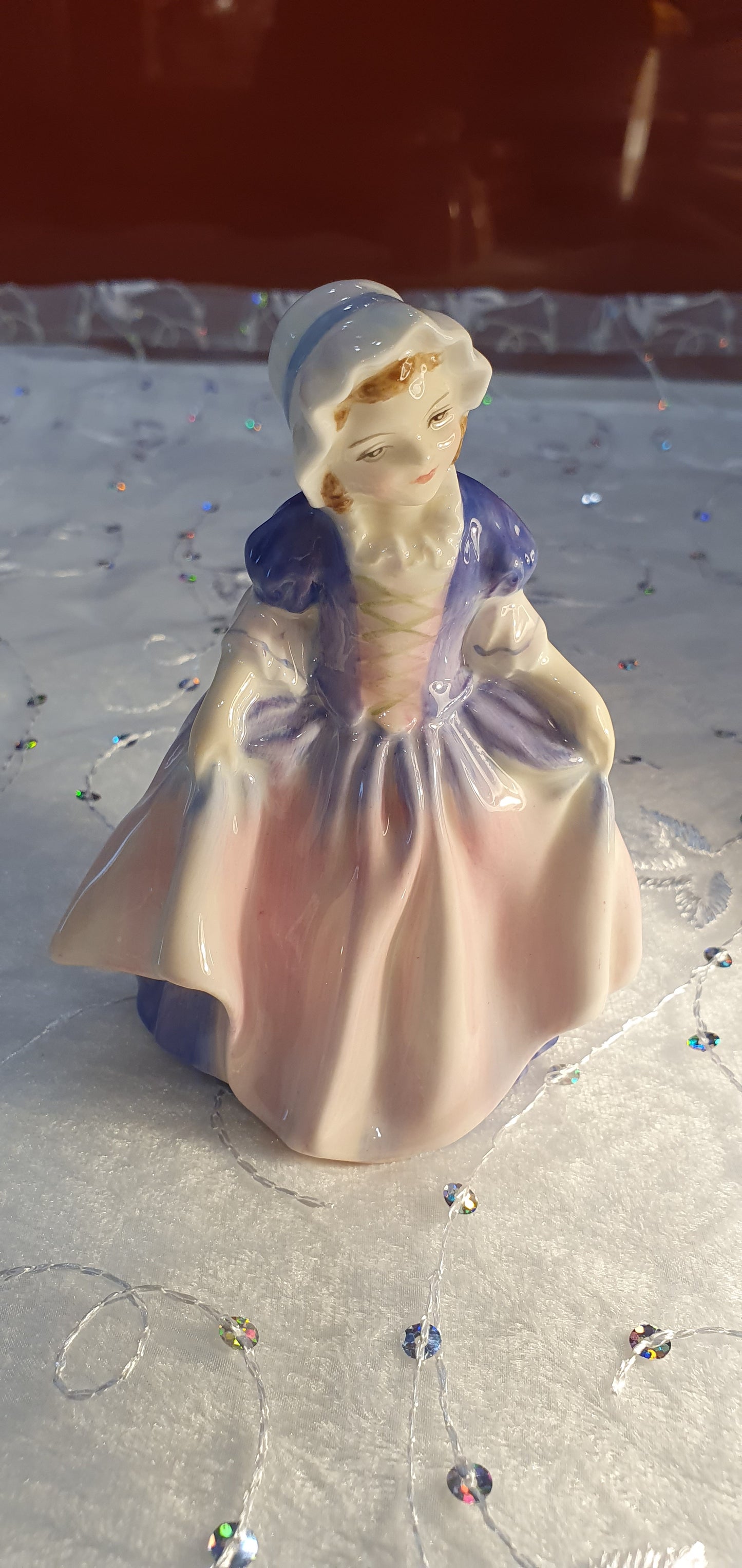 A Royal Doulton girl figure is named 'Dinky Do' HN 1678