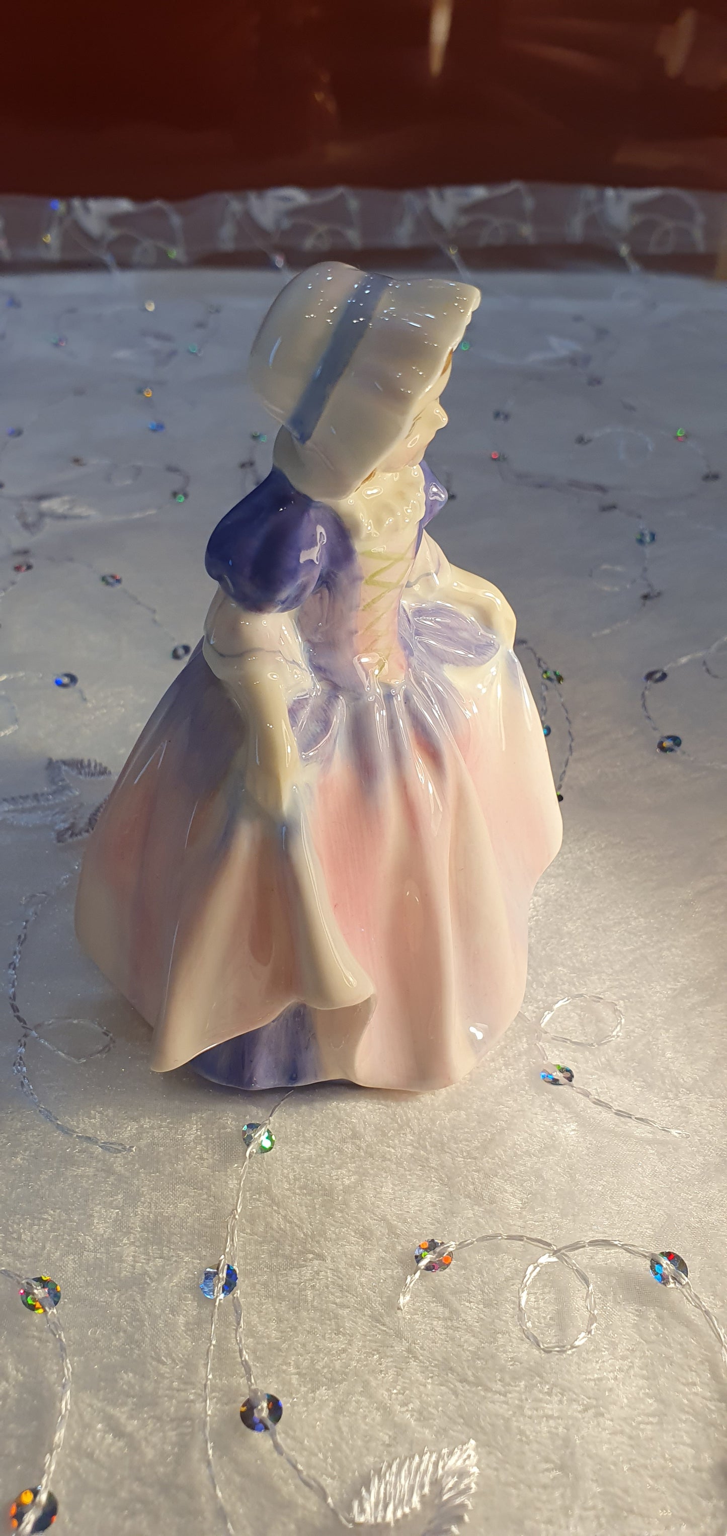 A Royal Doulton girl figure is named 'Dinky Do' HN 1678