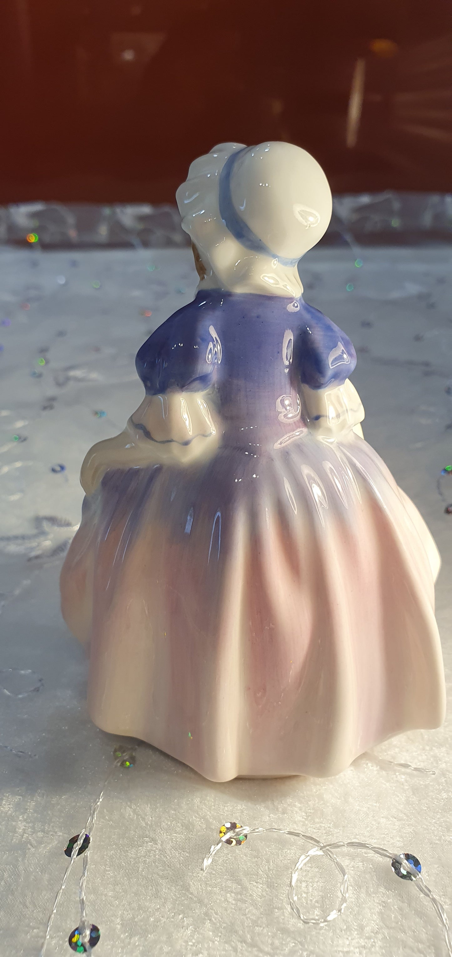 A Royal Doulton girl figure is named 'Dinky Do' HN 1678
