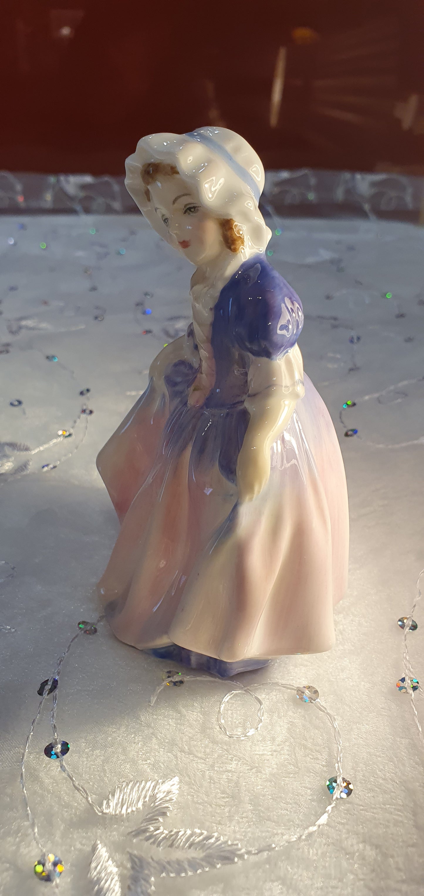 A Royal Doulton girl figure is named 'Dinky Do' HN 1678