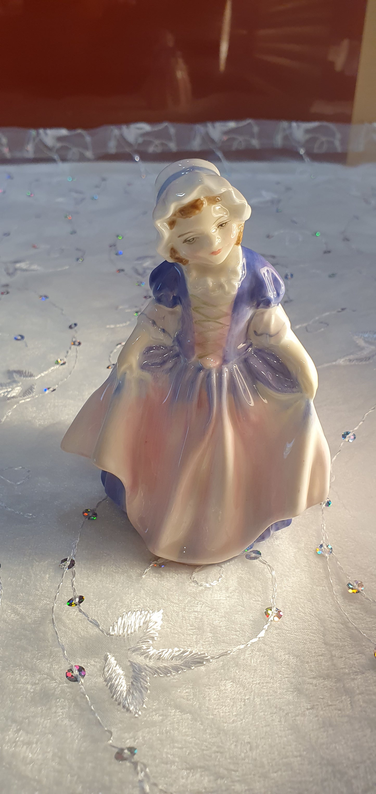 A Royal Doulton girl figure is named 'Dinky Do' HN 1678
