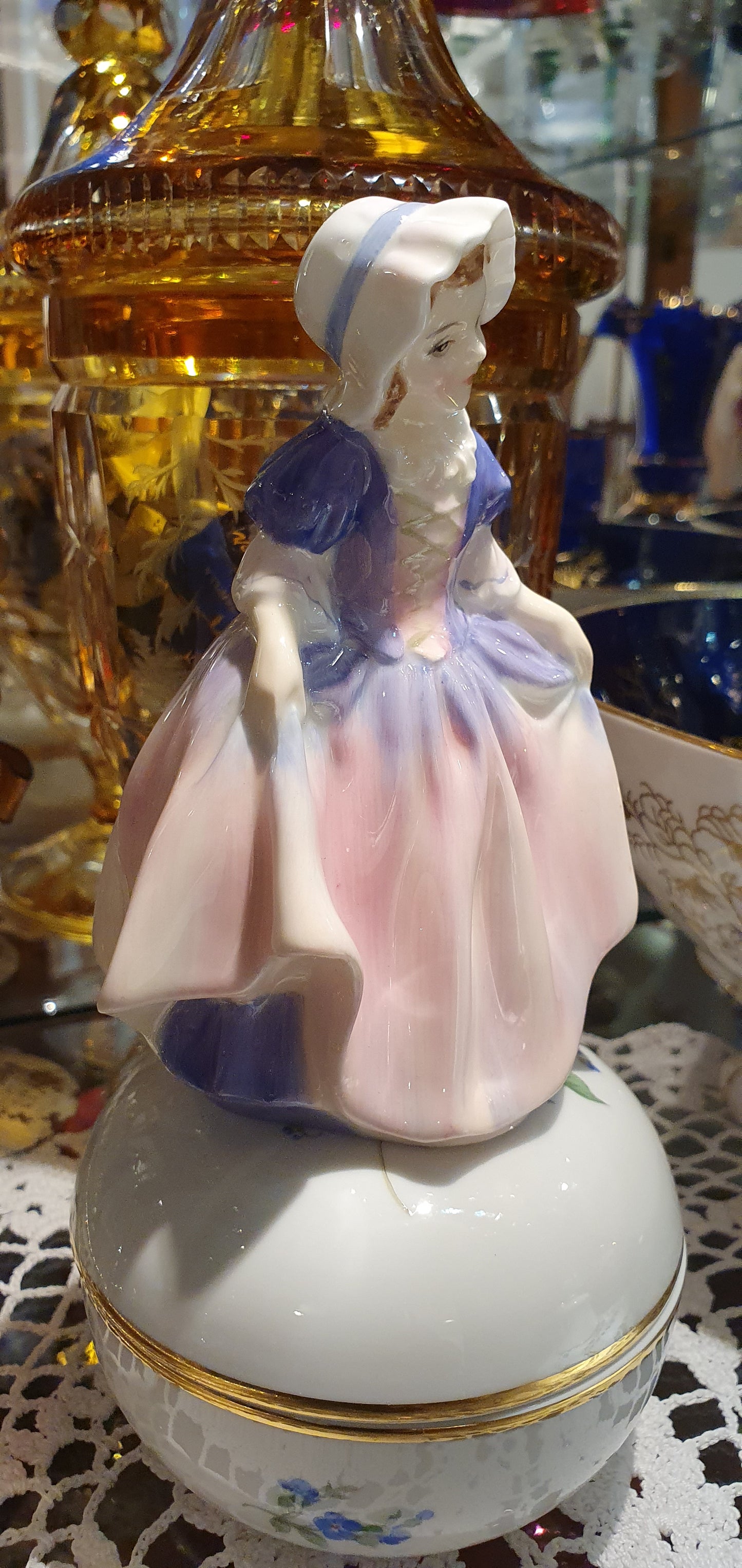 A Royal Doulton girl figure is named 'Dinky Do' HN 1678