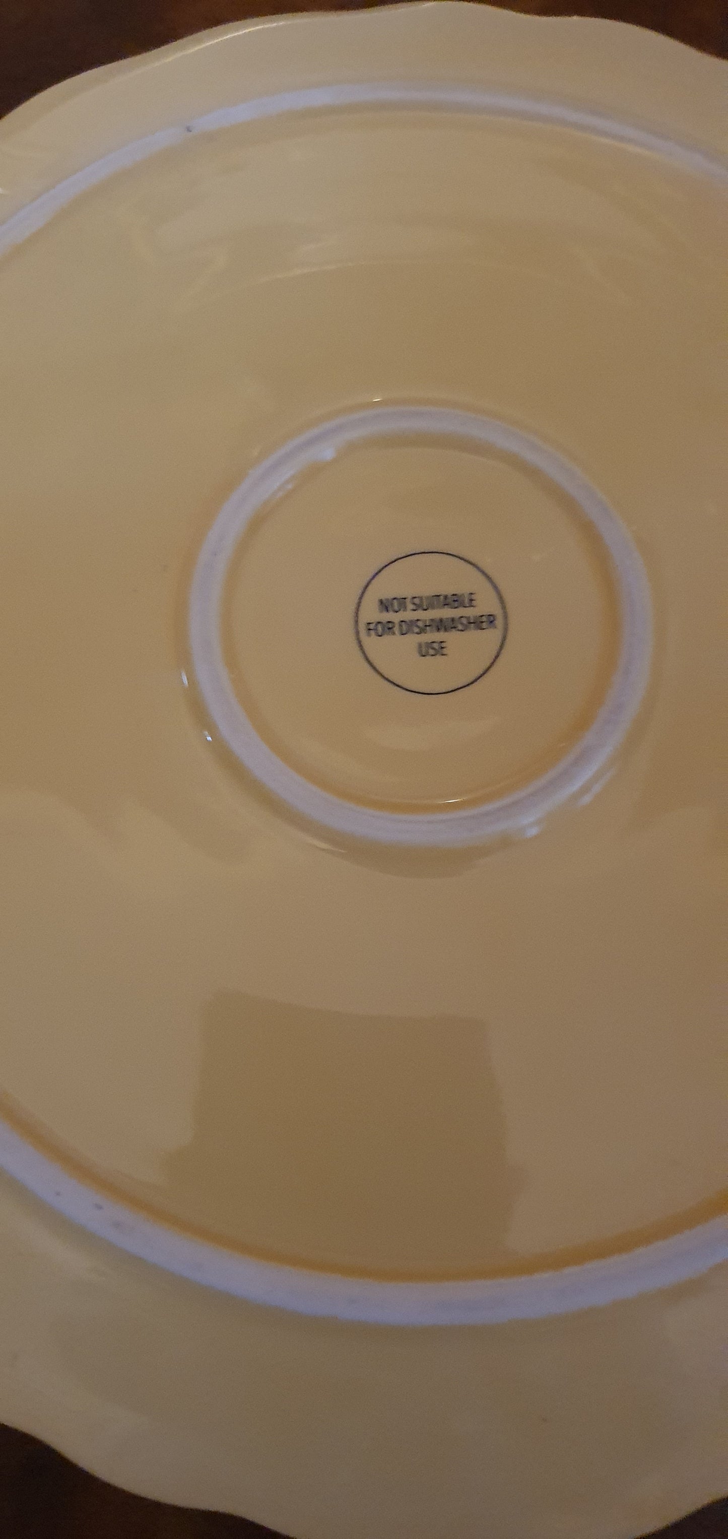 Elegant porcelain plate in soft yellow little bunny