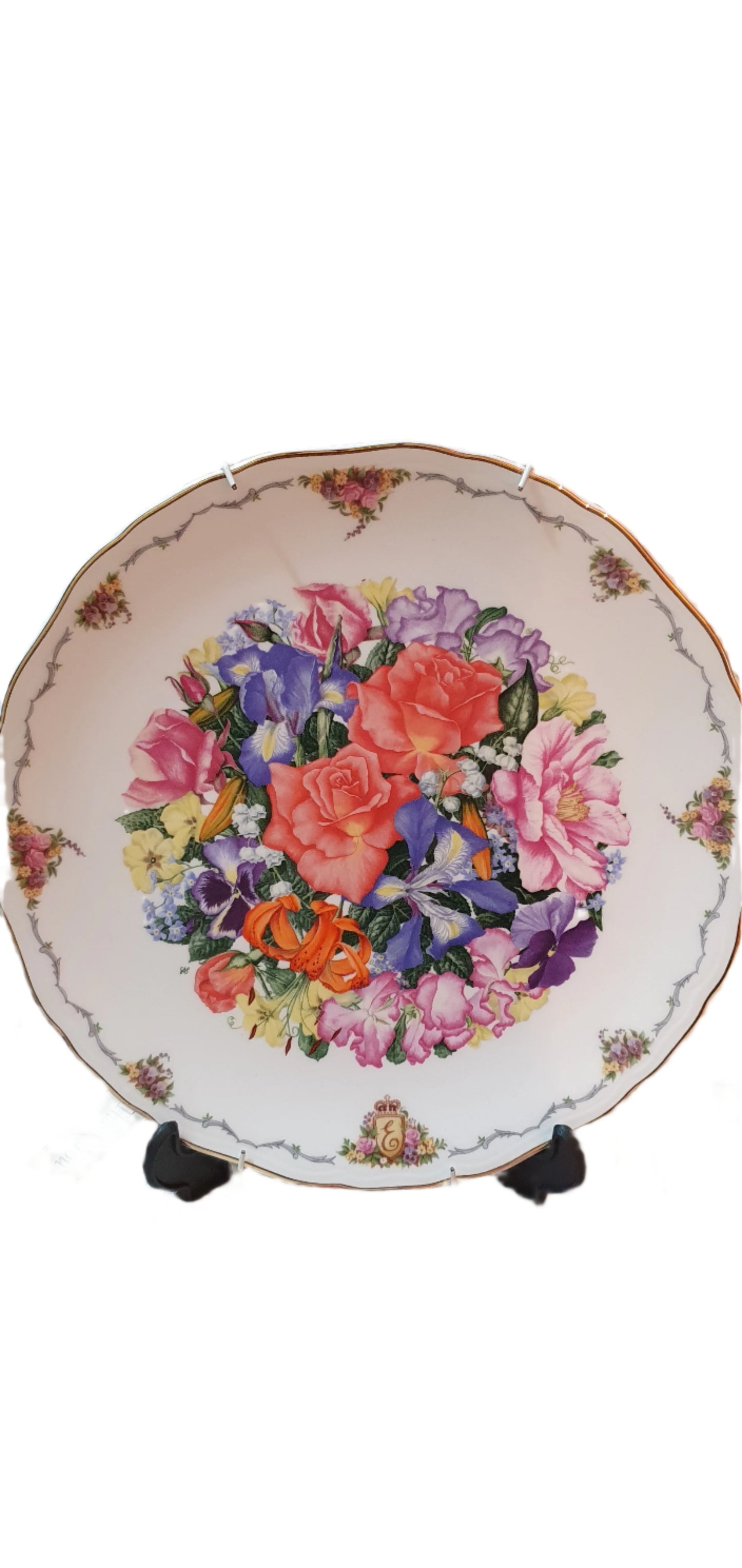 Decorative collectible porcelain plates from Royal Albert, part of "The Queen Mother's Favorite Flowers" series.