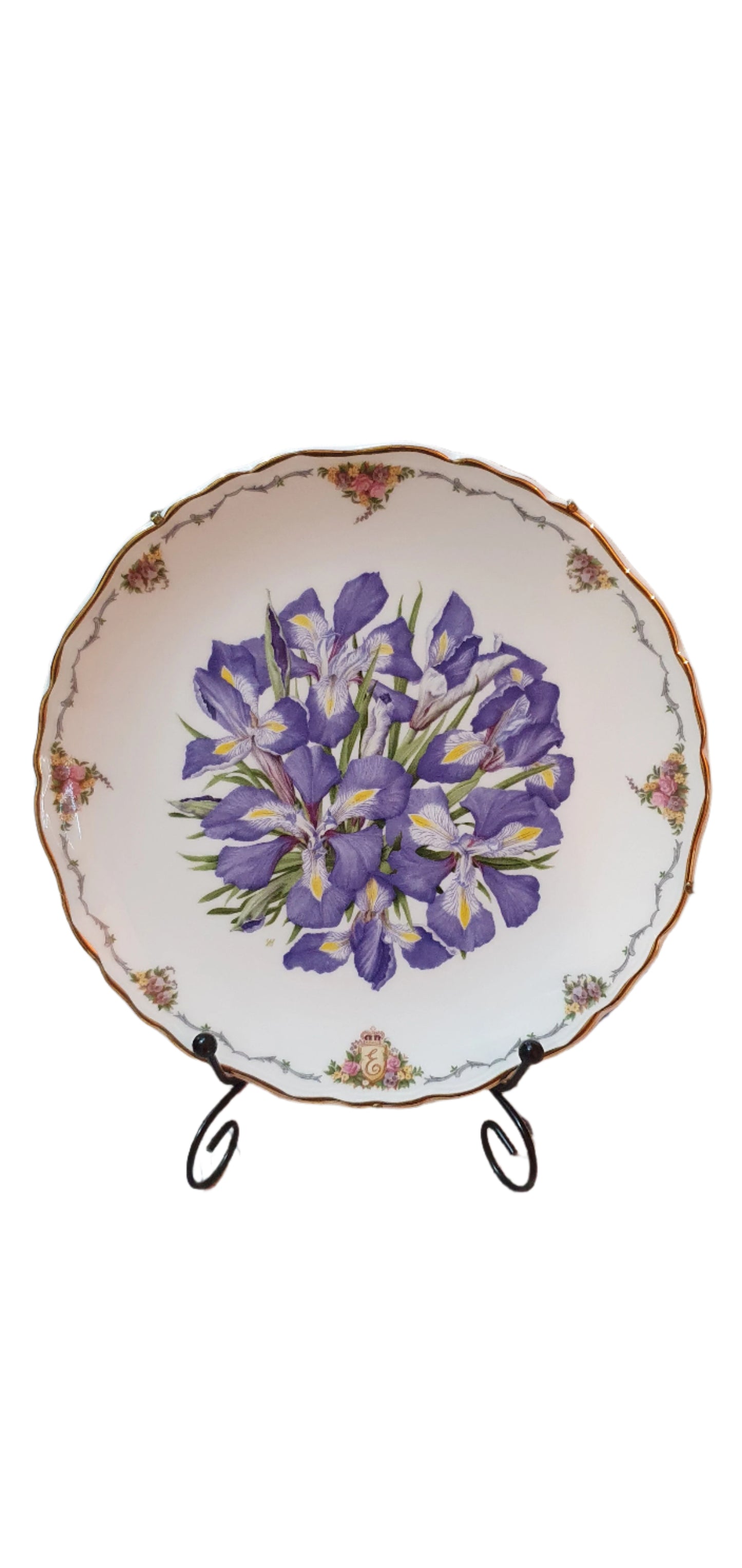Decorative collectible porcelain plates from Royal Albert, part of "The Queen Mother's Favorite Flowers" series.