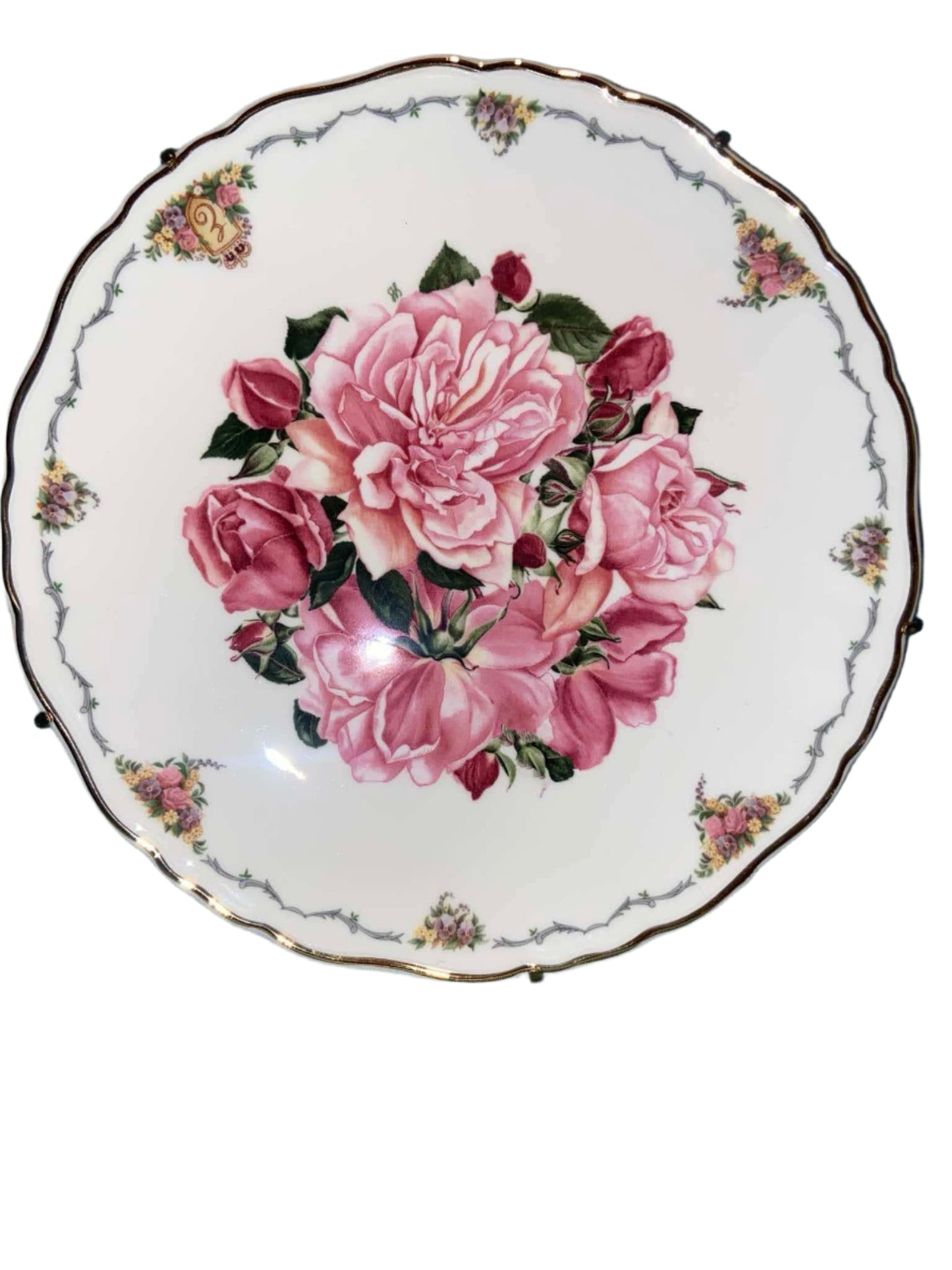 Decorative collectible porcelain plates from Royal Albert, part of "The Queen Mother's Favorite Flowers" series.